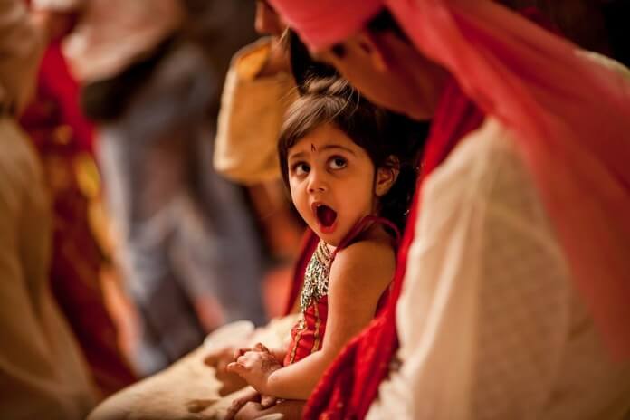 While Taking Your Baby in Indian Wedding