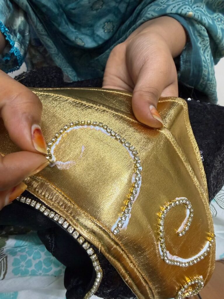 Handwork (crystals)Hand-stitching crystal detailing on a custom K-Pop Demon Hunters costume