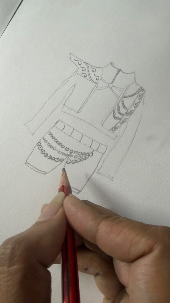 Sketch (single) Designer hand-sketching a custom K-Pop Demon Hunters costume for a child