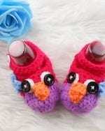Red and purple crochet baby girl booties, cute and comfy for gifting or festive events