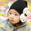 Black handmade winter hat for newborn baby, soft knitted design for warmth and comfort