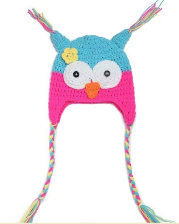 Pink blue knitted baby cap with colorful plaits, stylish winter wear for baby girl