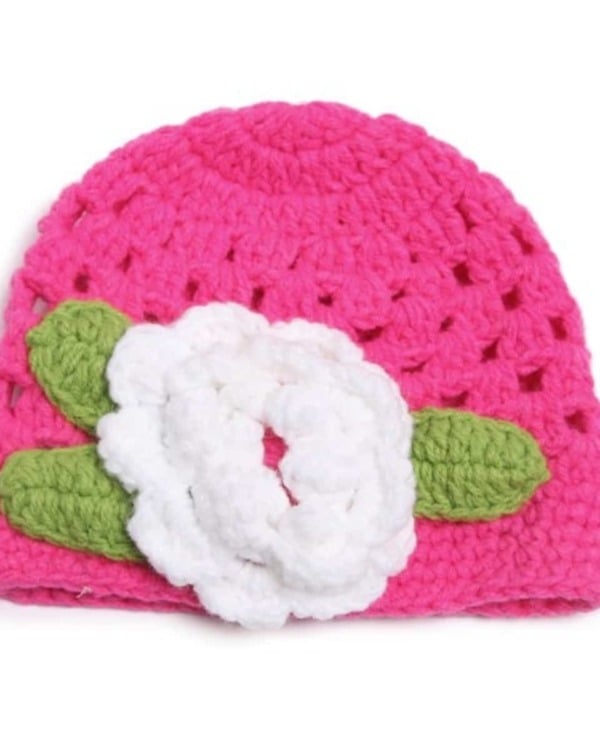Pink winter crochet knitted cap with white flower for babies, cute and stylish for gifting