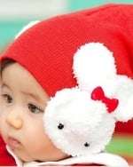 Red bunny ear winter cap for baby girl, cute knitted design for cold weather daily wear