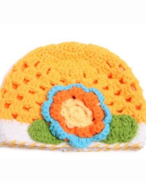 Yellow crochet winter hat for newborn baby, soft handmade design for warmth and comfort