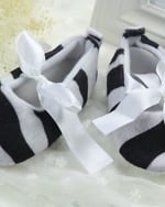 Baby girl shoes in grey and black stripes, stylish and festive for celebrations