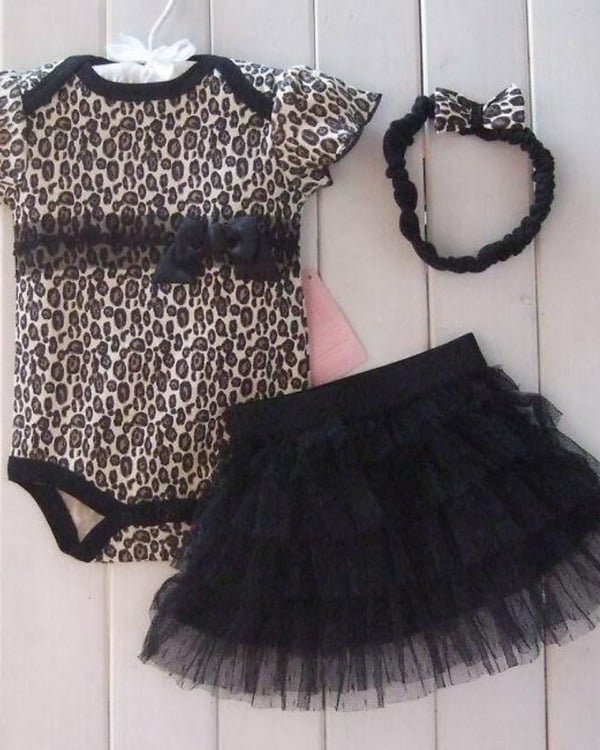 Black baby girl bodysuit with matching headband, stylish for special occasions