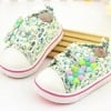 Kids shoes in white with blue and green floral print, stylish for parties