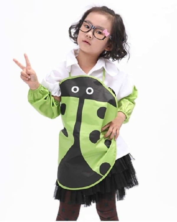 Green ladybug apron for kids, cute and comfortable for art and playtime use