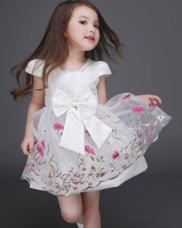 Little girl summer season floral dress in white, cute and festive