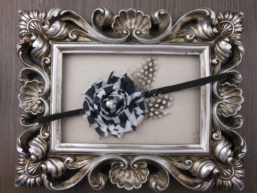 Sleek Black Infant Headband with Patterned Flower and Pearl Embellishment