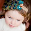 Sleek Brown Net Headband for Children with Peacock Feathers