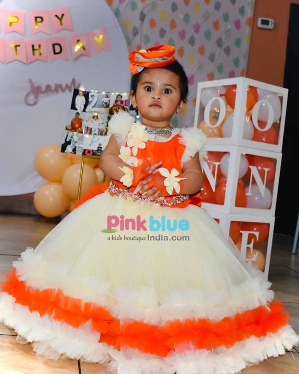 Long orange gown for girls birthday party with trail stylish outfit
