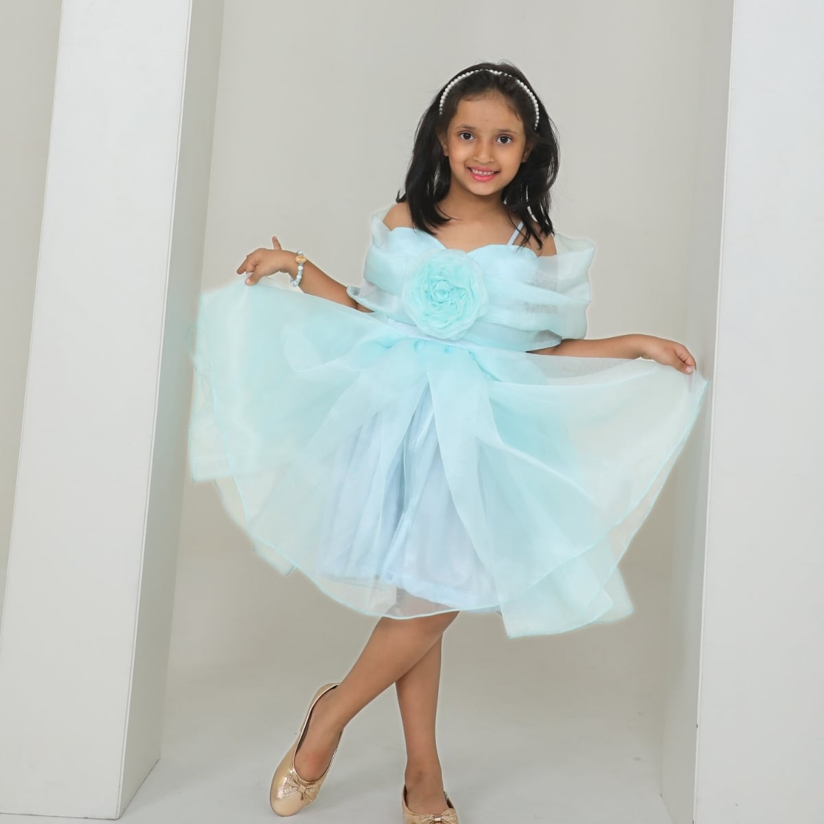 Back view of girls aqua blue organza off shoulder birthday frock with 3D fabric rose for small birthday party