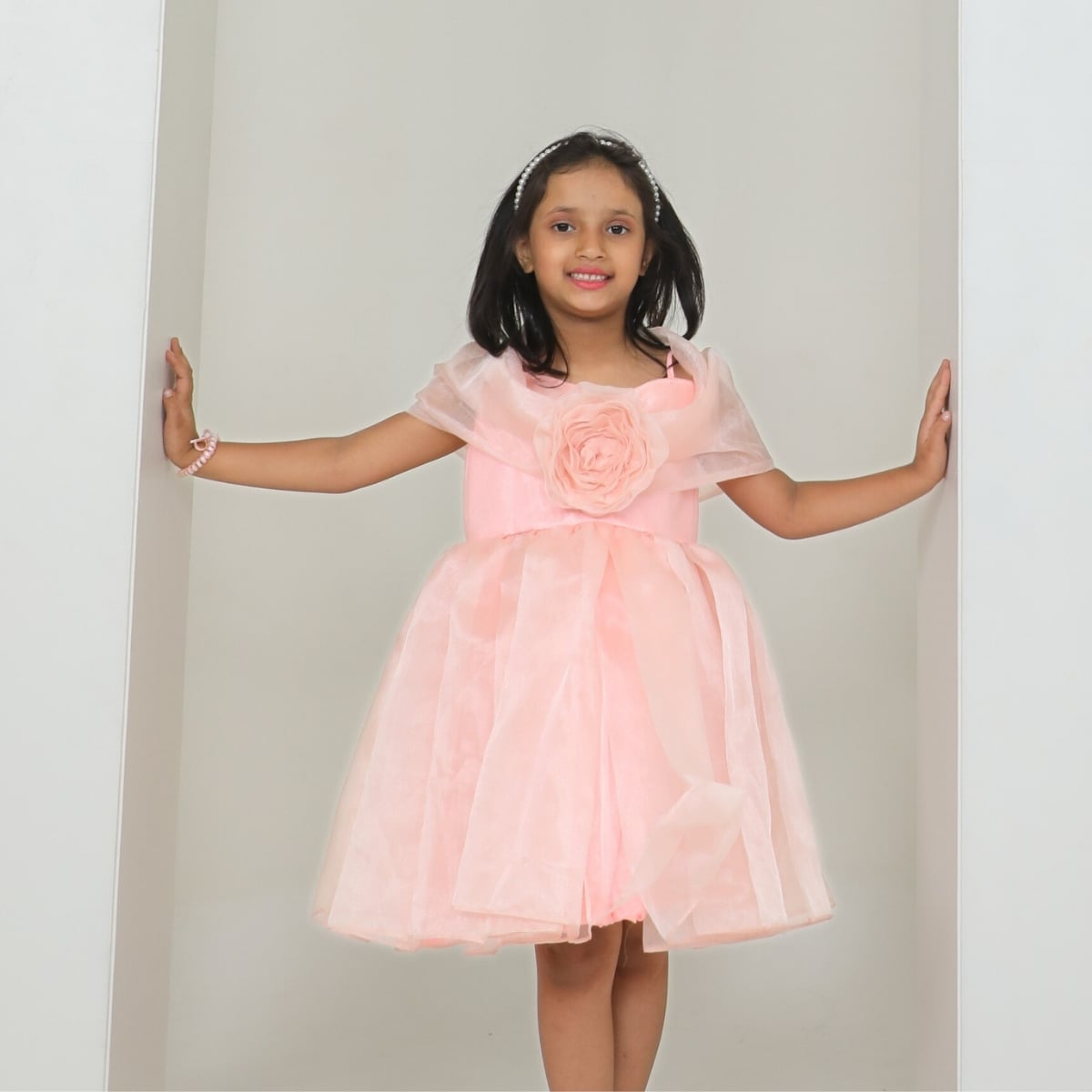 Girls beige off shoulder organza birthday party frock with 3D fabric rose and ruffle hem, full length view