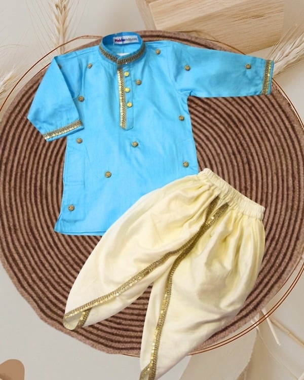 Blue cotton boys kurta and cream dhoti set with gold sequin border laid flat, kids wedding ethnic wear India