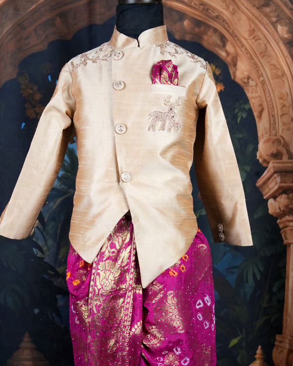 Boys gold silk sherwani and magenta banarasi bandhani dhoti set on mannequin for kids wedding India