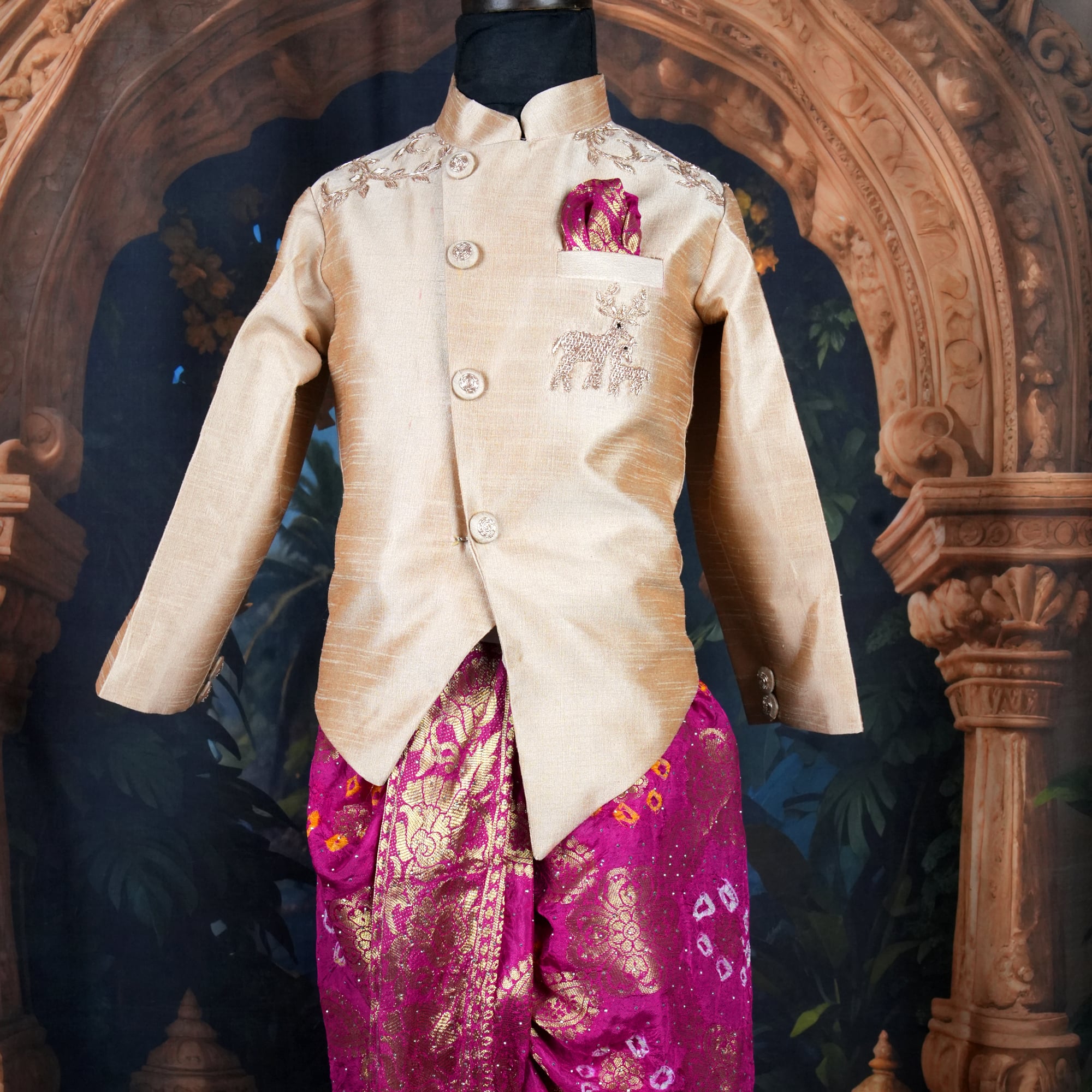 Boys gold silk sherwani and magenta banarasi bandhani dhoti set on mannequin for kids wedding India